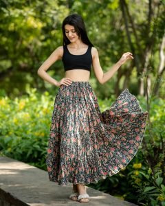 Woman twirling in a floral hand-screen printed tiered cotton maxi skirt — Skirts